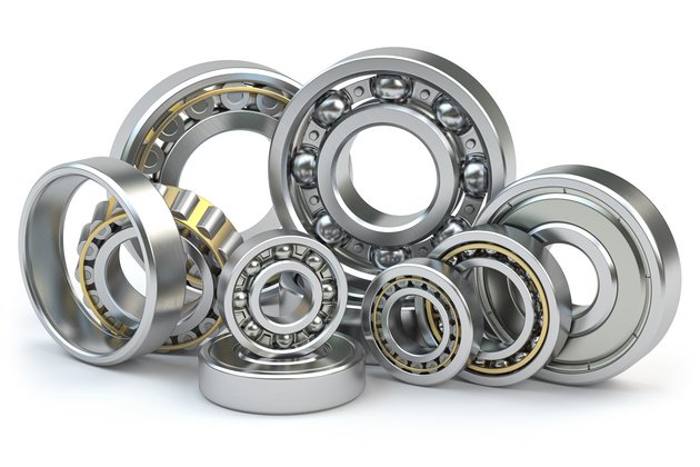 Close-up of different types of bearings isolated on white background